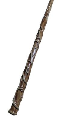 an old fashioned wooden stick with carvings on it's end and the handle is made out of wood