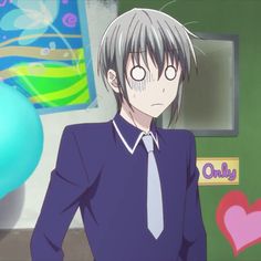 an anime character wearing a blue shirt and tie standing in front of a green wall