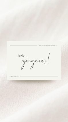 a white card with the word hello gorgeous written on it