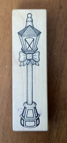 a rubber stamp with a lamp on it