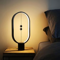 a lamp that is on top of a night stand