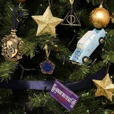 a christmas tree decorated with harry potter ornaments