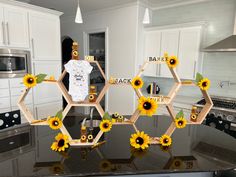 sunflowers are arranged in hexagonal frames on a kitchen counter