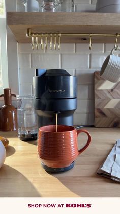 a coffee cup sitting on top of a counter