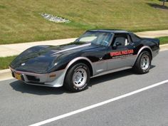 a black sports car parked on the side of the road