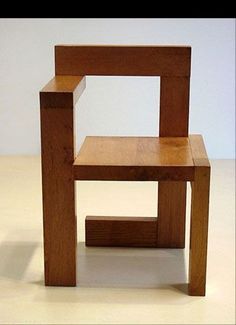 a wooden chair sitting on top of a white floor