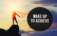 a person standing on top of a mountain with the words wake up to achieve