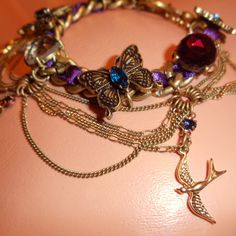 Original Pre Bankruptcy Piece By Betsey Johnson Beautiful Blue And Purple Crystal Rhinestone Butterfly Charms Gold Sparrow Bird Velvet Ribbon Puffy Hearts Red Ruby Bow Arrows Love Boho Bohemian Princess Mermaid Renaissance Indie Gothic Gypsy Pinup Doll Dollbaby Barbie Retro Vintage Chains Burlesque Cabaret Sexy Perfect Gift New With Tags. From My Personal Collection. Bohemian Jeweled Purple Jewelry, Purple Metal Bracelets For Party, Purple Metal Bracelet For Party, Pinup Doll, Bohemian Princess, Princess Mermaid, Butterfly Charm Bracelet, Sparrow Bird, Bow Arrows