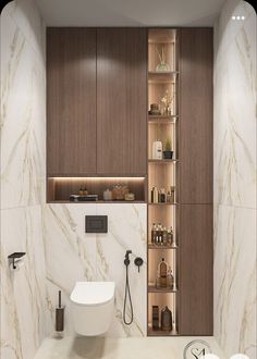 a bathroom with marble walls and flooring, including a white toilet in the center