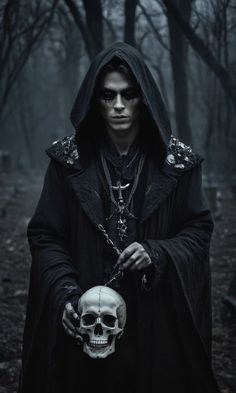 a man dressed in black holding a skull and wearing a hooded jacket with hood on