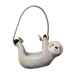 a ceramic ornament shaped like a slotty hanging from a rope