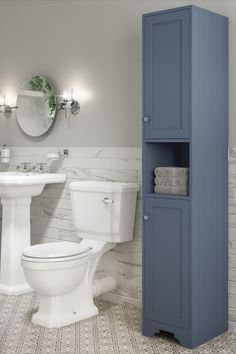 Blue bathroom tallboy unit in bathroom with white toilet, basin and round mirror. Bathroom Units Ideas, Tall Bathroom Cabinets, Boy Bathroom, Vanity Shelves, Grey Storage