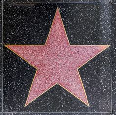 a star on the hollywood walk of fame with a beer bottle in it's center