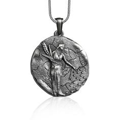 Goddess Demeter Necklace in Sterling Silver, Ancient Greek Pendant, Goddess of Earth Necklace, Greek Mythology Charm Jewelry , Gift for Him. The Demeter Necklace is a beautiful and meaningful piece of jewelry that celebrates the Greek goddess of agriculture and harvest, Demeter. It is silver plated and features a detailed image of Demeter holding a bundle of wheat.  This necklace is perfect for showing your faith in the Lord and makes a wonderful gift for any special occasion. The intricate deta Mythological Round Pendant Necklace For Gifts, Mythological Pendant Necklaces As Gifts, Mythological Sterling Silver Pendant Necklace, Sterling Silver Mythological Pendant Necklace, Mythological Silver Round Pendant Necklace, Silver Mythological Round Pendant Necklace, Silver Mythological Necklace For Gift, Silver Handmade Mythological Necklace, Mythological Style Silver Necklace For Gift