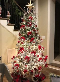 a decorated christmas tree with red and white ornaments