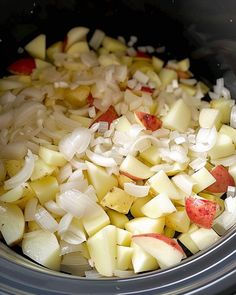 chopped onions and apples in a slow cooker