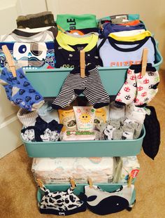 a blue cart filled with baby items on the floor