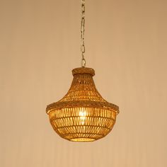 a light that is hanging from a ceiling in a room with beige walls and flooring