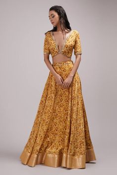 Mustard attached cancan lehenga with all over abstract prints. Paired with a padded, coordinating blouse with placement sequin embellishments and dupatta. - Aza Fashions Elegant Floral Print Choli For Diwali, Fitted Silk Maxi Length Set, Bollywood Floral Print Sets For Party, Floor-length Floral Print Sets For Diwali, Fitted Floor-length Tilla Dresses, Fitted Floor-length Dresses With Tilla, Bohemian Fitted Anarkali Set With Sheer Dupatta, Bohemian Fitted Sharara With Sheer Dupatta, Designer Skirt Set For Festivals