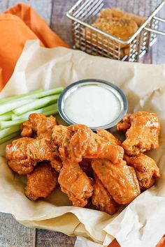 chicken wings with ranch sauce and celery sticks