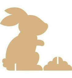 a silhouette of a rabbit sitting on the ground