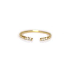 This minimalistic stacking talon ring is incredibly effortless and can be easily added to any stack. Its versatile open design nests well with both sleek and chunky pieces, making it your new favorite go-to. Try stacking this open diamond ring with our Golden Grace Twist ring and Alinea ring for a modern yet subtle look. Custom 1/2 and 1/4 sizes are available for a $25 resizing fee. Please put your size request in the notes section during online checkout. To order this piece in a different metal Open Diamond Ring, Twist Ring, Rings Cool, Open Design, Pink Bracelet, White Ring, White Diamonds, 14kt Gold, Birthstone Jewelry