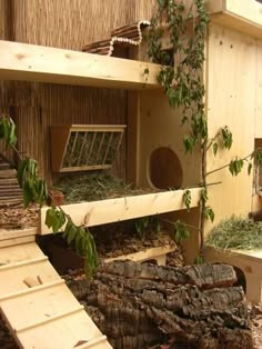 an animal house with wood and plants inside