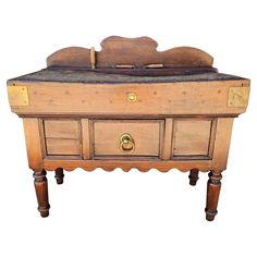 an old wooden chest with drawers and knobs