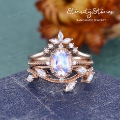 a ring with an oval blue topazte surrounded by white and rose gold accents