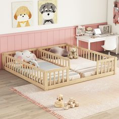 a baby's room with two wooden cribs and toys on the floor