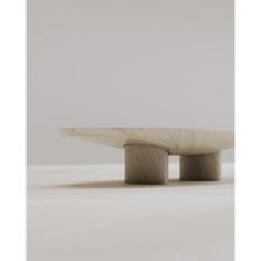 a white table sitting on top of a white floor