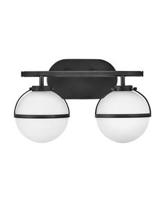 two lights that are on the side of a wall mounted fixture, one is white and one is black