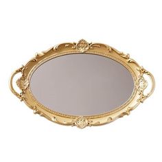 an ornate gold tray with a mirror on the top and bottom, is shown in this image