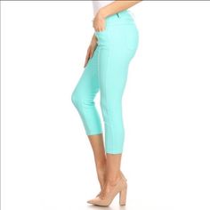 Super Cute And Comfy Capris. Rhinestone Button. Turquoise Stretch Bottoms, Blue Cropped Leg Capris For Spring, Blue Fitted Capris, Fitted Blue Capri Pants, Blue Fitted Capri Pants, Blue Stretch Mid-rise Capris, Green Stretch Cropped Leg Bottoms, Stretch Turquoise Bottoms For Spring, Casual Fitted Turquoise Pants