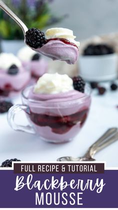 blackberry mousse with whipped cream and blackberries in a glass bowl on a white table