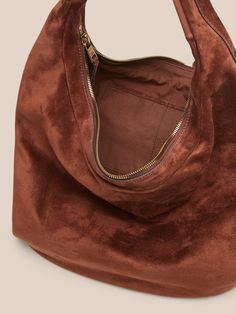 Part hobo bag, part tote bag, this carryall is crafted in soft suede for a slouchy, relaxed look that's also luxurious.  Zip top closure.  External zip pocket.  Internal pocket.  Fully lined.  Height: 10. 8" (27. 5cm) Width: 20" (50cm) Depth: 6" (15c Chic Hobo Bag With Zipper Pocket For Fall, Double Handle Suede Bucket Bag With Soft Leather, Suede Tote Shoulder Bag With Handle Drop, Chic Bucket Bag With Suede Lining For Everyday, Chic Suede Hobo Bag, Chic Suede Hobo Bag With Removable Pouch, Suede Hobo Shoulder Bag With Zipper Closure, Suede Hobo Shoulder Bag With Zipper, Suede Shoulder Bucket Bag