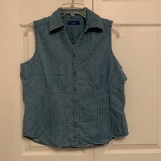 Purchased New And Never Used Karen Scott Sport Medium Denim Chambray Button Down Sleeveless Blouse. Breast Darts, Curved Hem Lines. In Excellent Clean Condition. Smoke Free Home! Casual Medium Wash Button-up Vest, Casual Denim Blue Vest Top, Washed Blue Button-up Denim Vest For Summer, Sleeveless Denim Blue Top With Buttons, Casual Denim Blue Vest With Buttons, Medium Wash Sleeveless Vest With Button Closure, Sleeveless Medium Wash Vest With Button Closure, Sleeveless Vest With Button Closure In Medium Wash, Sleeveless Denim Blue Vest With Buttons