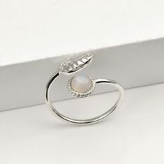 Beautiful adjustable flower ring in sterling silver. The ring wraps with a 5mm moonstone and a beautiful detailed leaf on the other. The adjustable rings are perfect when are not sure of the ring size of your dear ones. It comes packed in a box. Delivery: We try to ship the order the same working day if ordered before 12pm. We use Royal Mail 24, for U.K. and Royal Mail signed and tracked for International deliveries. Ring Moonstone, Moonstone Ring Sterling Silver, Ring Flower, Stylish Rings, Leaf Ring, Wrap Rings, Moonstone Ring, Open Ring, Ring Sterling Silver