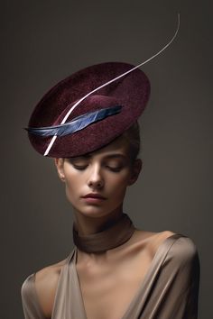 Rhia is a stunning occasion hat made from rich velour felt, modelled here in Bordeaux.  The hat is finished with a composition of feathers shown in navy and pink. This occasion hat is ideal for those special occasions, such as garden parties, investitures or a day at the races. Each hat is made exclusively by hand once you place your order.  You can order the hat in over 50 colour combinations.   This hat is so flattering, it suits so many face shapes due to its size and angle.  Please ask if yo Royal Garden Party, Race Day Hats, Hat With Feather, Felted Hats, Occasion Hats, Halo Headband, Metal Comb, Women Hats, Hat Custom