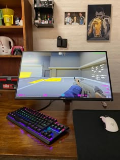 a computer monitor sitting on top of a wooden desk next to a keyboard and mouse