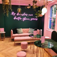 a living room filled with pink furniture and green walls that says not all roses are better than yours