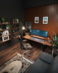 a living room filled with furniture and a computer desk