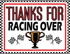 a sign that says thanks for racing over with a trophy and checkered flags in the background