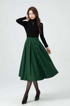 This green midi wool skirt has single-breasted design.  The attention to detail in the construction of this high waist circle skirt is evident in every stitch, show casing the craftsmanship and expertise that went into its creation.  DETAIL * 30% wool, 30% fiber, 40% polyester * Fully satiny lining, more nice to the touch body * Two side seam pockets * Front button closure, Button down skirt * Elastic waist at back, Plus size skirt * Midi wool skirt * Wool skirt women * High waist skirt, A Line skirt * For autumn and winter * Dry clean * Lean More about the items From the FAQs on the page bottom MODEL SIZE Bust 85 cm(33.4") Waist 67 cm(26.7") Height 168cm (5' 6") She wears size XS Choose CUSTOM Order if you * Need a better fit * Can't find your size in our size Chart * Change the Style * C Long Skirt With Button Closure For Fall, Green Lined Maxi Skirt For Fall, Green Midi Skirt Bottoms For Winter, Office Midi Skirt With Buttons, Fall Green Lined Maxi Skirt, Green Midi Skirt With Pockets, Green Lined Skirt For Fall, Green Lined Maxi Skirt For Work, Relaxed Midi Skirt With Buttons