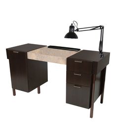 a desk with two drawers and a lamp