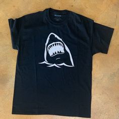 Black T-Shirt With Silver Shark Shark Graphic Tee, Cheap Crew Neck T-shirt With Shark Design, Summer T-shirt With Shark Design And Short Sleeves, Black Short Sleeve T-shirt With Dinosaur Print, Silver Shark, Blue Short Sleeve T-shirt With Shark Design, Wolf T Shirt, Concert Tshirts, Beach T Shirts