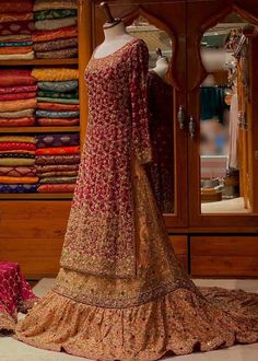 a dress on display in front of a mirror