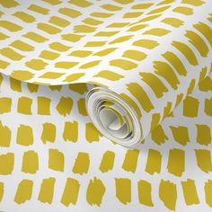 a yellow and white wallpaper with an abstract design