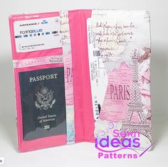 an open passport case with a pink cover