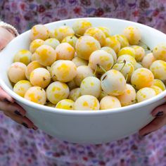 a white bowl filled with lots of yellow speckles